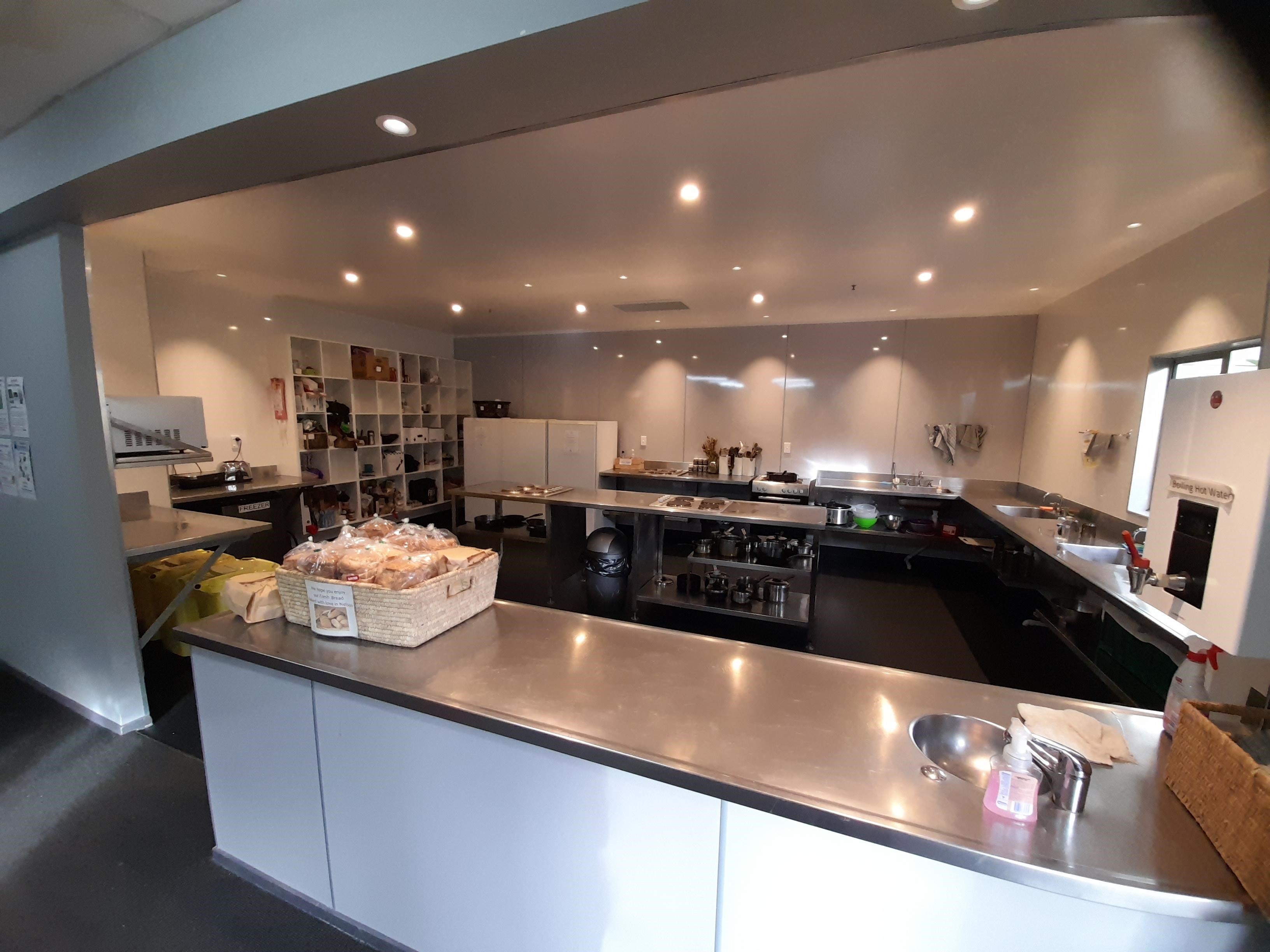Kitchen (3) Cooking in the large well equipped kitchen at Accents YHA Hostel Nelson