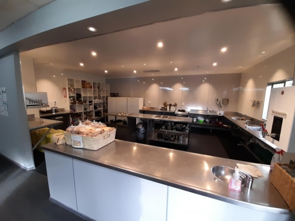 Cooking in the large well equipped kitchen at Accents YHA Hostel Nelson