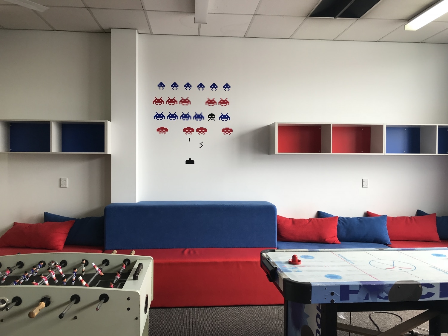 Lounge with comfy sofas, foosball and Air Hockey in Nelson Hostel